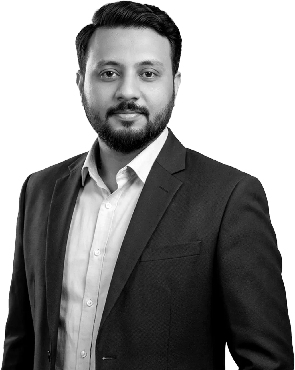 Black-and-white portrait of Abin T Jose in a suit, standing with one hand in his pocket